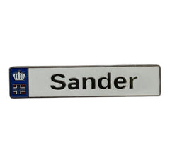 Pinkgul.no decorative metal sticker with the name Sander and a small crown logo on a white background