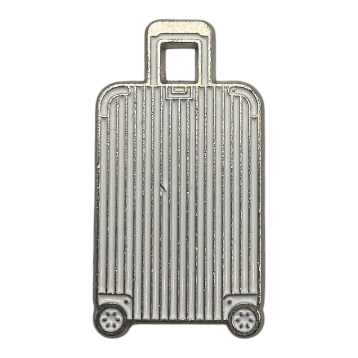 Pinkgul.no decorative silver metal suitcase sticker with a raised, detailed design for electronic devices.