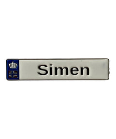 Pinkgul.no Simen decorative metal sticker with a raised name design and blue crown emblem on a white background