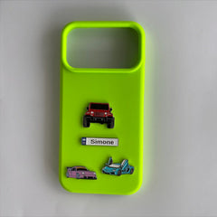 Pinkgul.no Simone decorative metal stickers featuring cars and a name tag on a bright neon green phone case