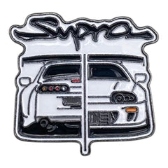 Pinkgul.no decorative metal sticker featuring a detailed Toyota Supra car design with raised black and white lines.