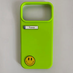 Pinkgul.no Tuva decorative metal sticker with smiley face on a bright lime green phone case