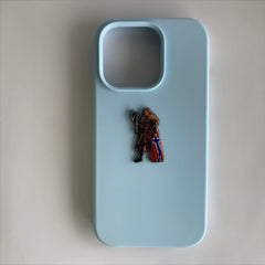 Pinkgul.no Vindra decorative metal sticker featuring a Viking warrior design applied to a light blue phone case