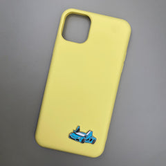 Pinkgul.no yellow phone case with a decorative blue sports car metal sticker attached at the bottom
