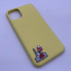 Pinkgul.no yellow phone case with a decorative metal sticker featuring an Eiffel Tower and red balloons design